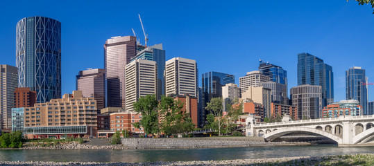Calgary's skyline on a beautiful spring day. Calgary is the corporate centre of the oil industry in Canada. - obrazy, fototapety, plakaty