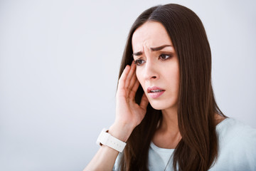 Sick woman having a headache