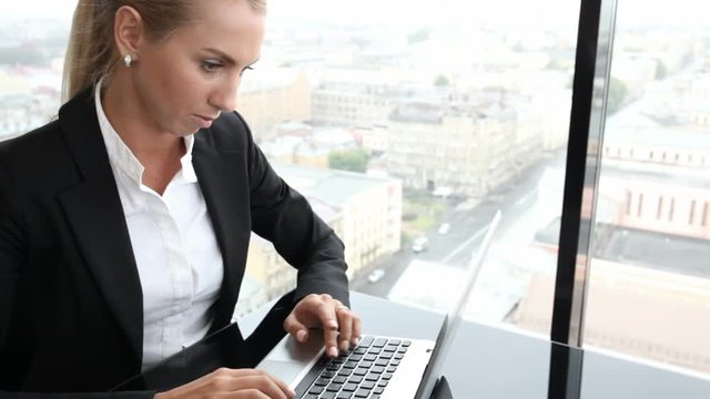 Businesswoman working with laptop in office
