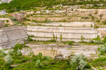 warehouse production in quarry blue clay, huge machines stacking
