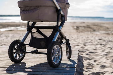 Baby stroller on beach