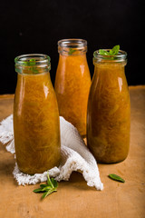 Fresh rhubarb compote with fresh mint in a bottle