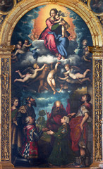 CREMONA, ITALY - MAY 24, 2016: The painting of Madonna in heaven and the saints on the main altar in Chiesa di San Sigismondo by Antonio Campi (1524  - 1587).