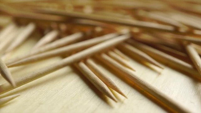 Heap of wooden toothpicks macro rotation shot