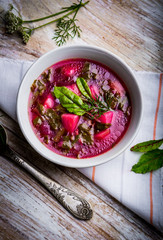 Soup with fresh young beet in bowl