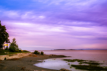sunset over St Lawrence river in Orleans Island,