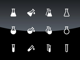 Flask and test tube icons on black background.