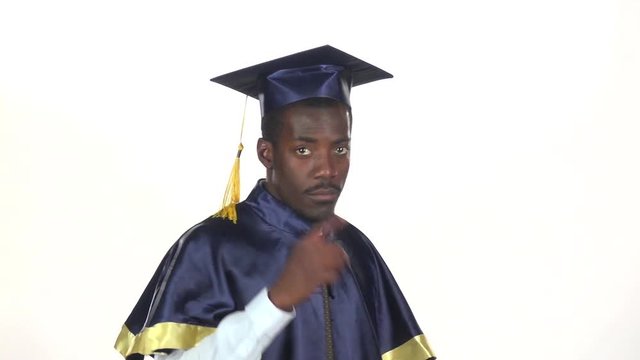 Graduate threatens with a finger. White. Slow motion. Close up