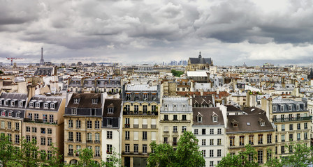 Fototapeta na wymiar Paris roofs panoramic overview at summer day