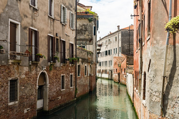 Fototapeta na wymiar A small canal in Venice, Italy