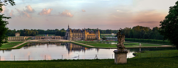 Chantilly castle panoramic view on sunset background - obrazy, fototapety, plakaty