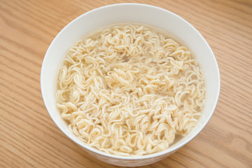 bowl of instant noodles on a wood table