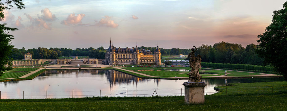 Chantilly castle panoramic view on sunset background