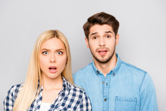 Shocked funny young couple  opening mouth