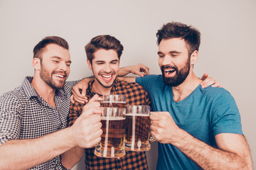 cheers! happy handsome men celebrating victory and clinking glas