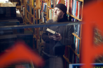 Person in books and antique store