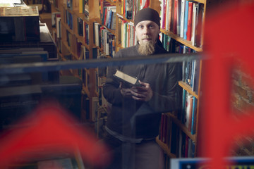 Person in books and antique store