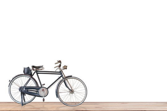 Old  bicycle  on wood , white background.