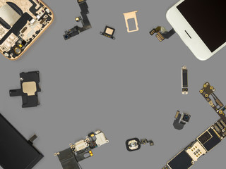 Flat lay (Top view) of smart phone components isolate on gray background with copy space