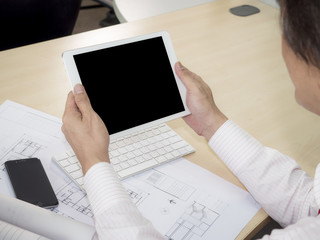 Business man hold tablet 1