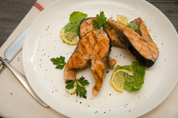 several salmon steaks plate spices