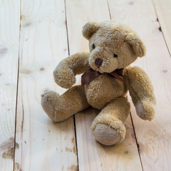 Teddy bear on wood pallet background