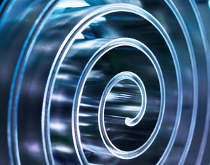 Metal spiral polished metal. Shallow depth of field.