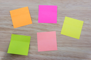 Color  Paper notes with sticky note on Wood Background