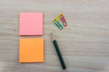 Color  Paper notes with sticky note on Wood Background