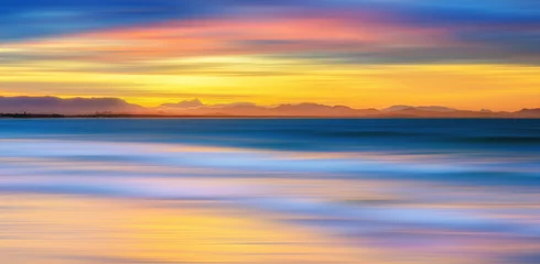 Tuinposter Sunset at the beach © andriislonchak