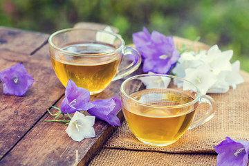 Two cups of herbal tee in the garden