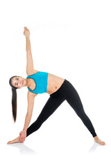 Yoga woman - pretty asian female in active wear doing yoga