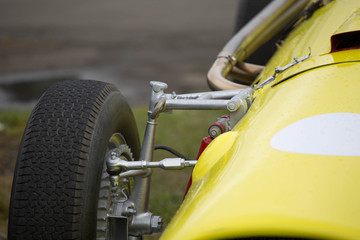 Vintage race car in the pits - obrazy, fototapety, plakaty