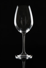 Empty wine glass on black background