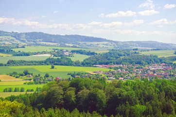 Obraz premium Czech landscape with mountains, clouds and trees