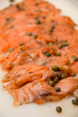 Smoked salmon slide  on a plate with parsley