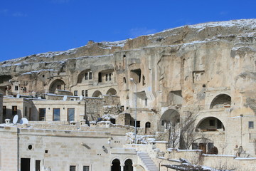 Close view of the traditional stone cut houses next to modern homes in Urgup, Cappadocia