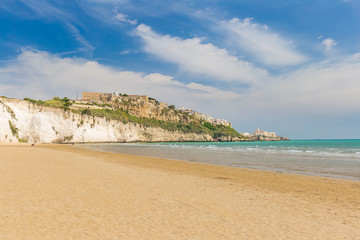 Golden sand beach of Vieste with Pizzomunno rock, Gargano peninsula, Apulia, South of Italy