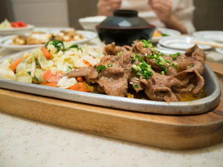 Beef with vegetables on hot plate, beef teppanyaki Japanese Cook