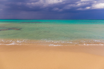 Amazing golden sand beach near Monopolli Capitolo, amazing atmosphere during stormy day, Apulia region, Southern Italy