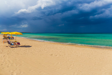 Amazing golden sand beach near Monopolli Capitolo, amazing atmosphere during stormy day, Apulia region, Southern Italy