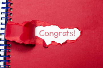 The word congrats appearing behind torn paper.