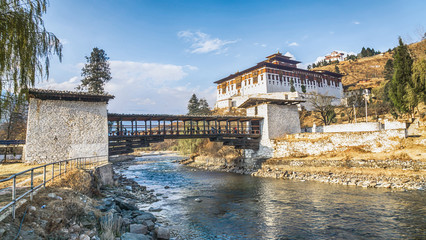 The bridge across the river with traditional bhutan palace, Paro - obrazy, fototapety, plakaty