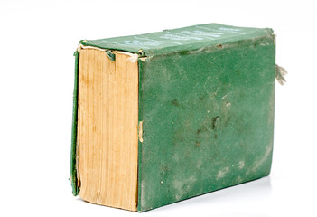 Single old hard cover green book isolated over white