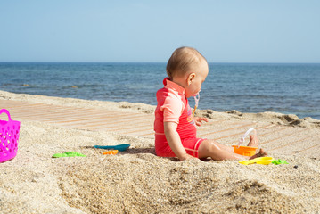 Baby alone at the seaside