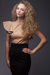 Naklejka premium Portrait of perfect woman with curly hair