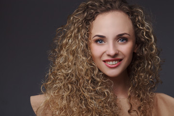 Portrait of woman with curly hair