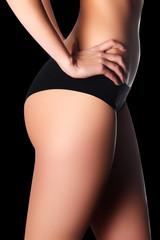 Naklejka premium Sexy body of a beautiful woman. Beautiful woman body. Perfect shape. Fitness concept