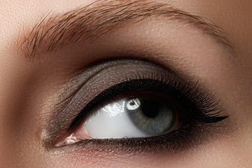 Fototapeta na wymiar Macro shot of woman's beautiful eye with extremely long eyelashes