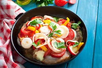 Pork baked with vegetables.